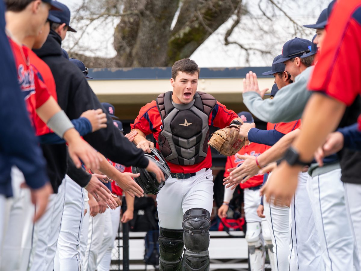 Santa Rosa catcher RJ Johnson makes his way down the lineup during announcements ahead of the game against College of Marin on Saturday, Feb. 14 at home.