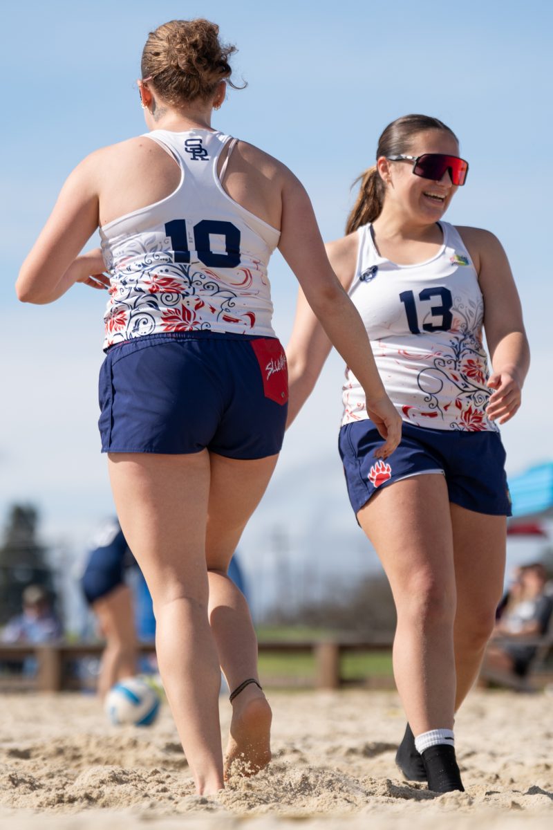 Bear Cubs Issa McIninch Rosko and Lily Seidler exchange smiles after winning a rally against Butte College at Spring Hills Church Feb. 23, 2026.