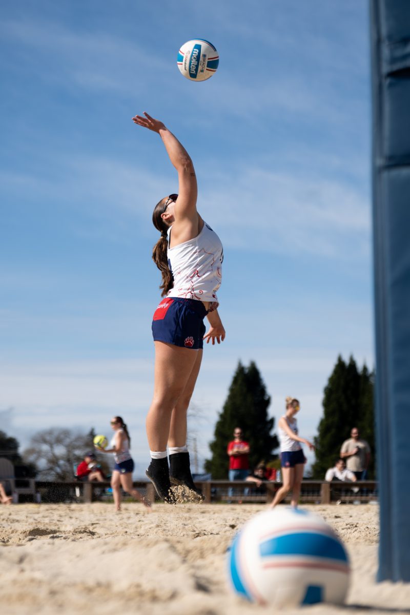Bear Cub Lily Seidler rises to spike the ball into Butte College sand at Spring Hills Church Feb. 23, 2026.