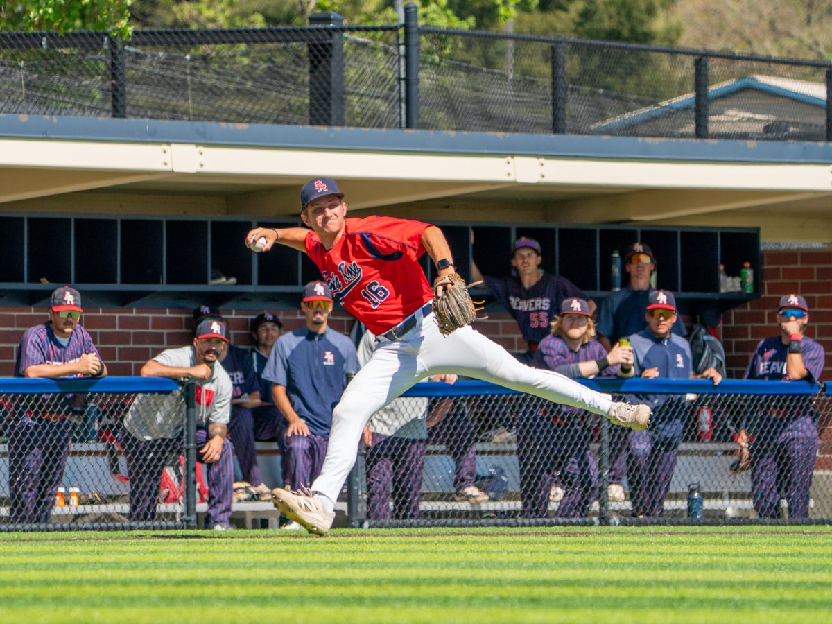 Third baseman Trevor Schlafer charges a ball coming down the third base line and launches in towards first base for the out against American River College at home on Thursday, March 19, 2026.