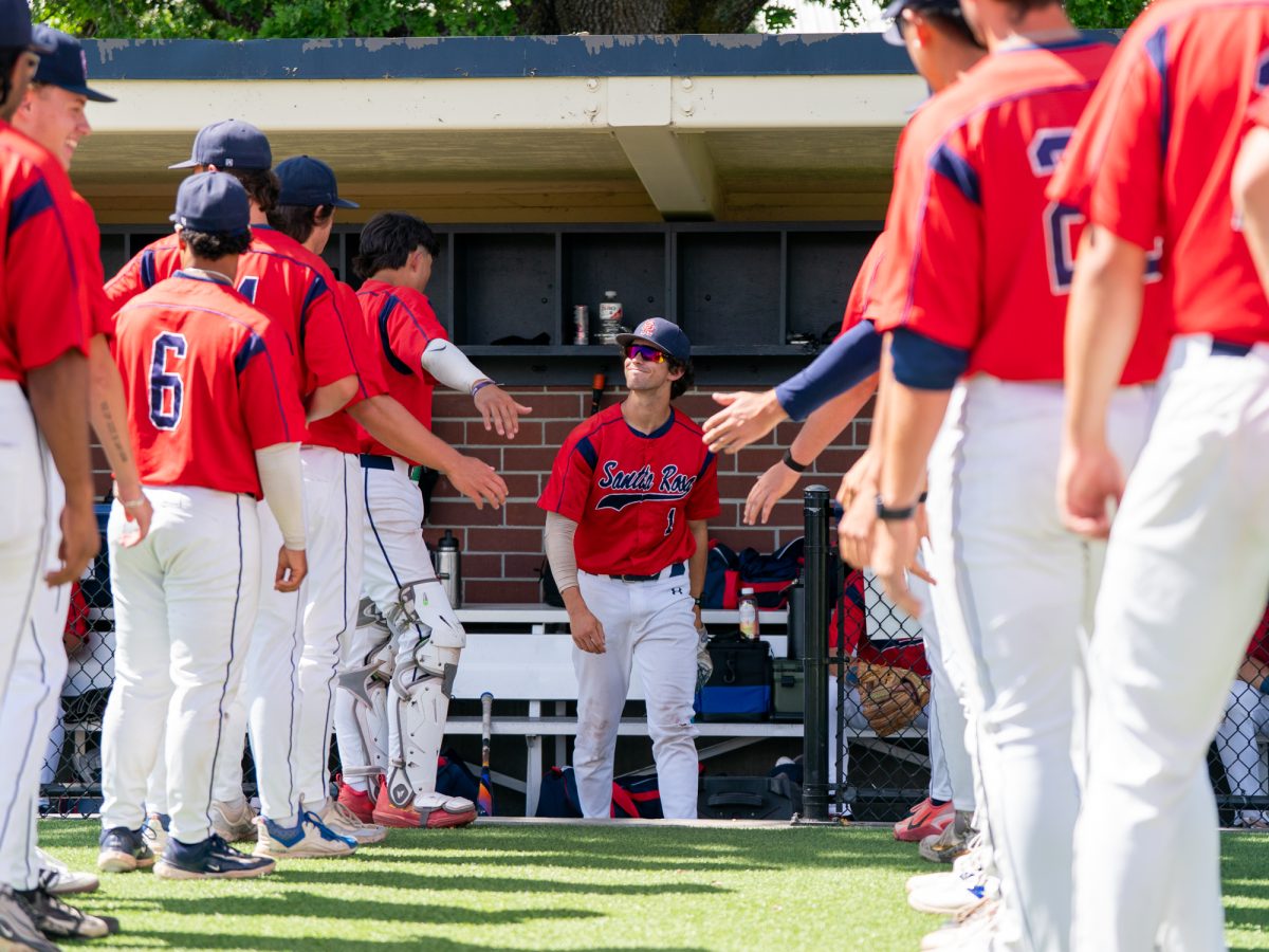 Center fielder Cooper Wood smiles up at his teammates prior to running through the tunnel for lineup announcements against Diablo Valley College at home on Friday, March 27, 2026.