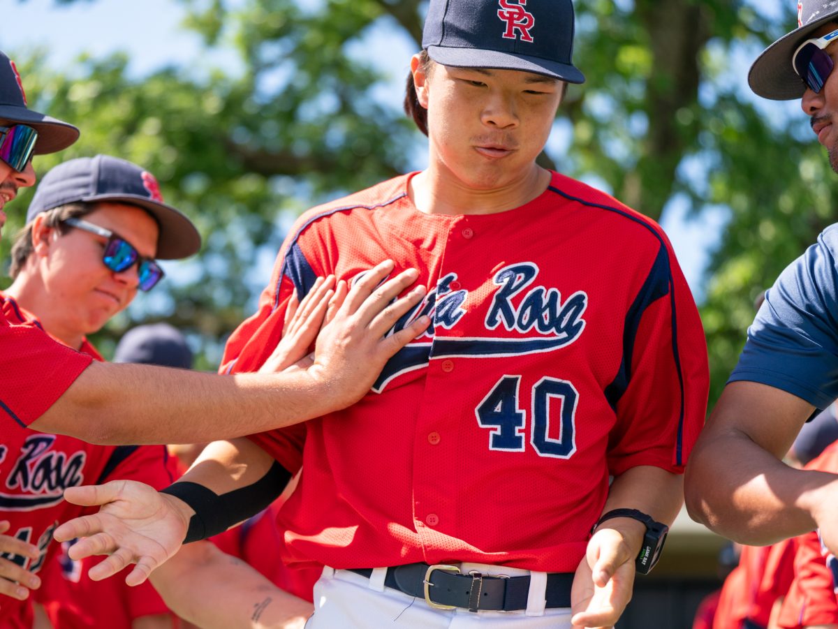 Designated hitter Aidan Sakai runs through a tunnel of his teammates prior to the game against Diablo Valley College at home on Friday, March 27, 2026.