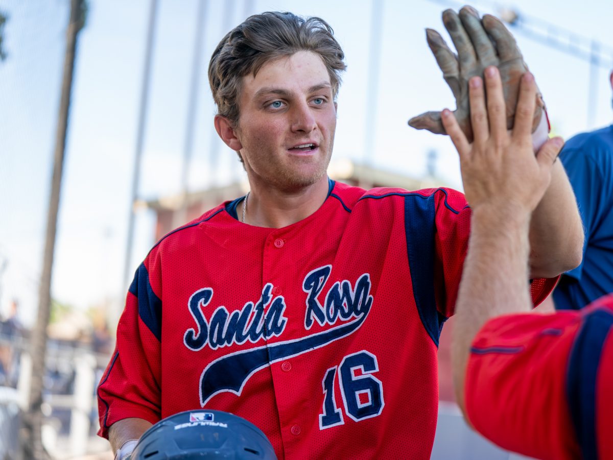 Third baseman Trevor Schlafer comes back to the dugout after scoring in the bottom of the eighth against Diablo Valley College at home on Friday, March 27, 2026.