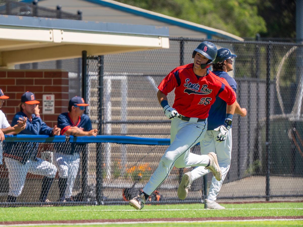 First baseman J.T. Summers bounds past the opposing dugout to score the Bear Cubs' third run of the game in the bottom of the third against College of the Sequoias at home on Friday, April 3, 2026.