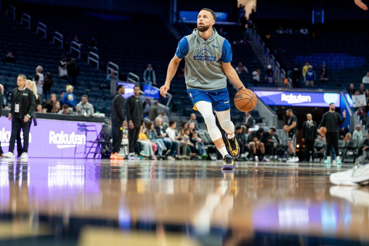 Warriors point guard Steph Curry hits the paint during pregame warm ups at Chase Center in San Francisco, Calif. on Tuesday, April 7, 2026.