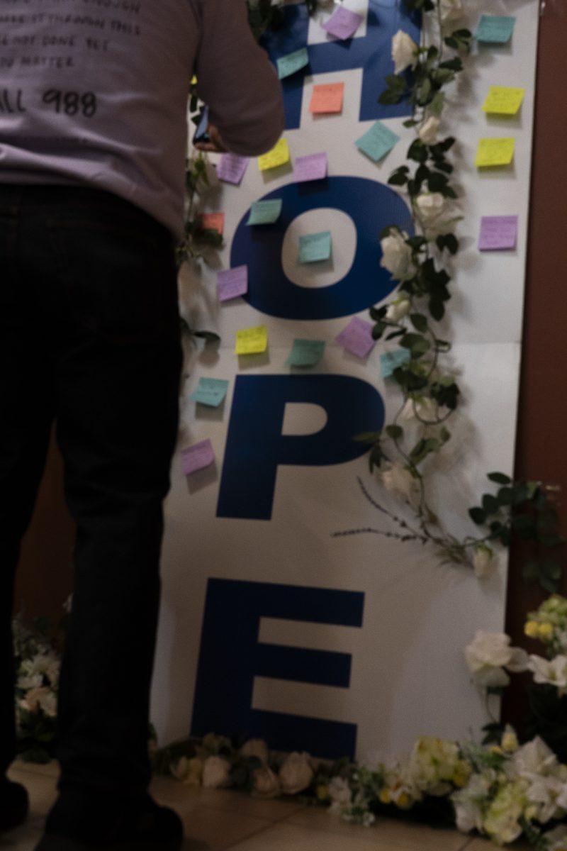 Attendees put sticky notes with messages of perseverance and solidarity [to who?]  in the Bertolini Student Center at Santa Rosa Junior College Saturday, April 11, 2026.