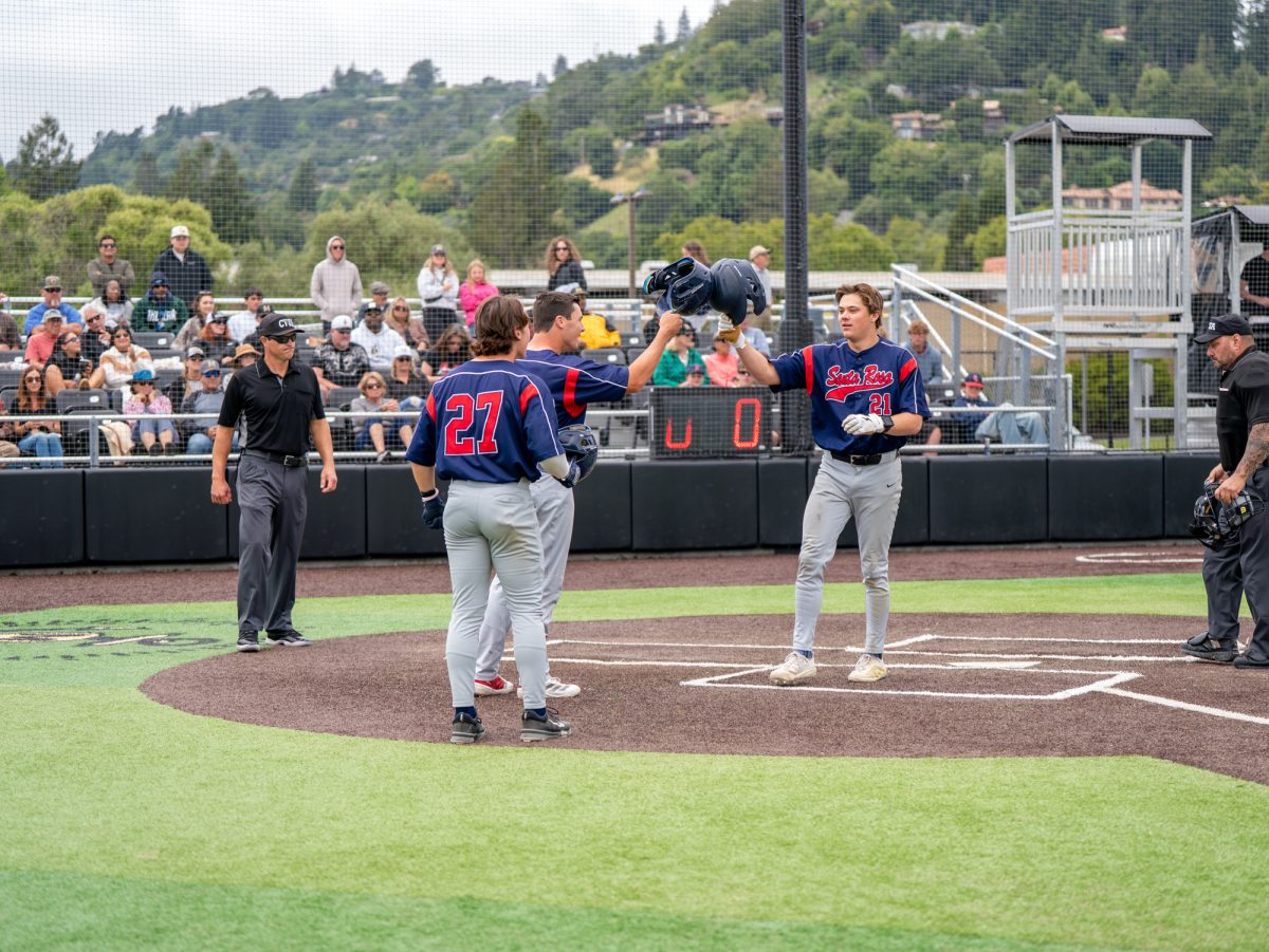 Left fielder Nic Sebastiani greets his teammates at home plate after hitting a home run in the top of the fourth against the Mariners in Marin on Saturday, May 2, 2026.
