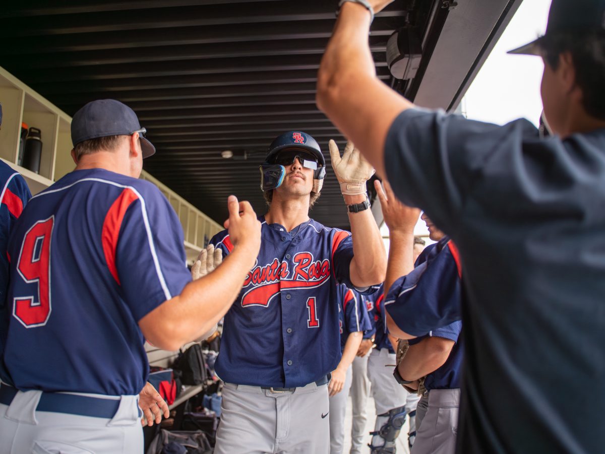 Center fielder Cooper Wood walks through the dugout after scoring a run against the Mariners on Saturday, May 2, 2026.
