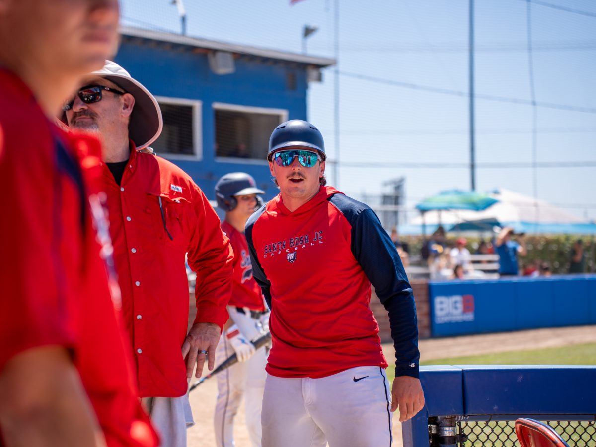 First base coach Connor Charpiot gets ready for another inning against Modesto Junior College in Modesto on Friday, May 8, 2026.