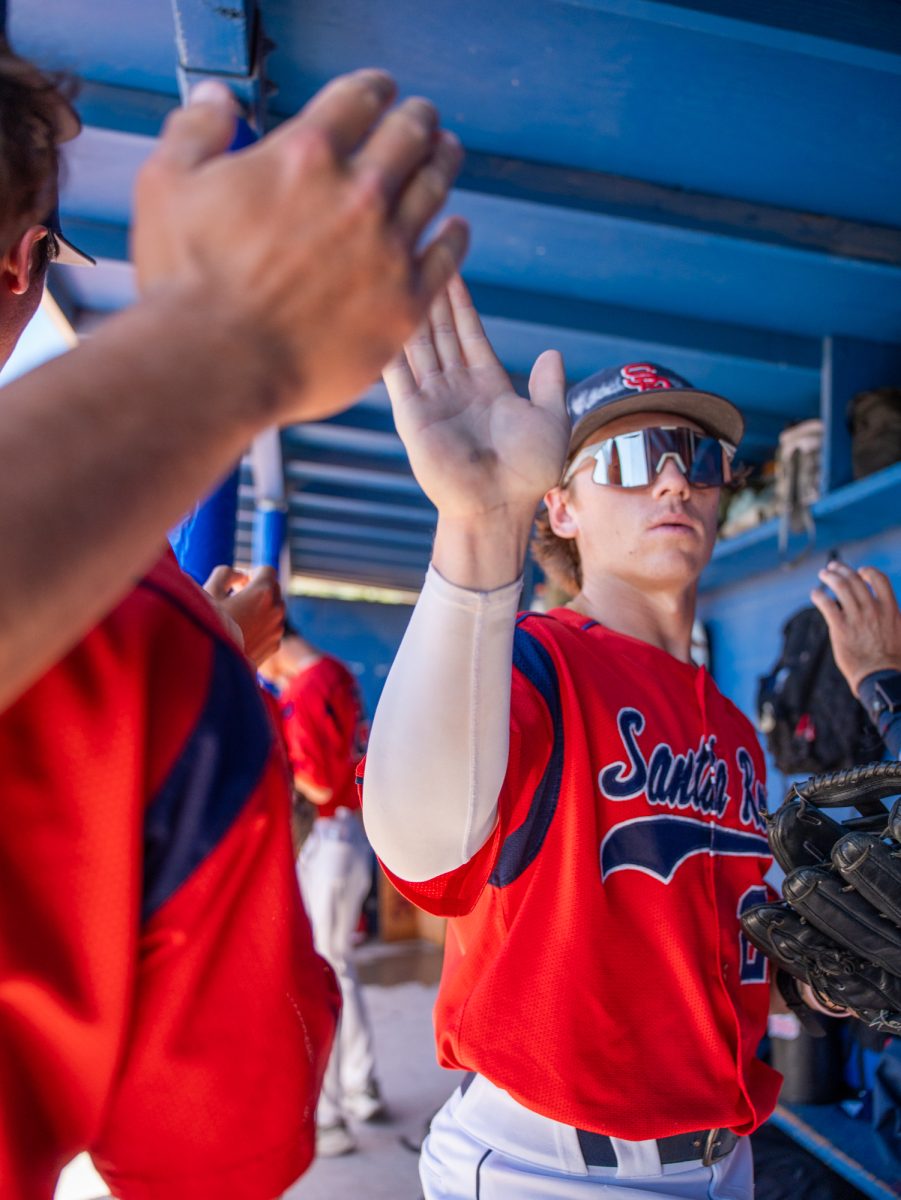 Miles Clayton makes his way into the dugout to get ready the next inning against Modesto Junior College in Modesto on Friday, May 8, 2026.