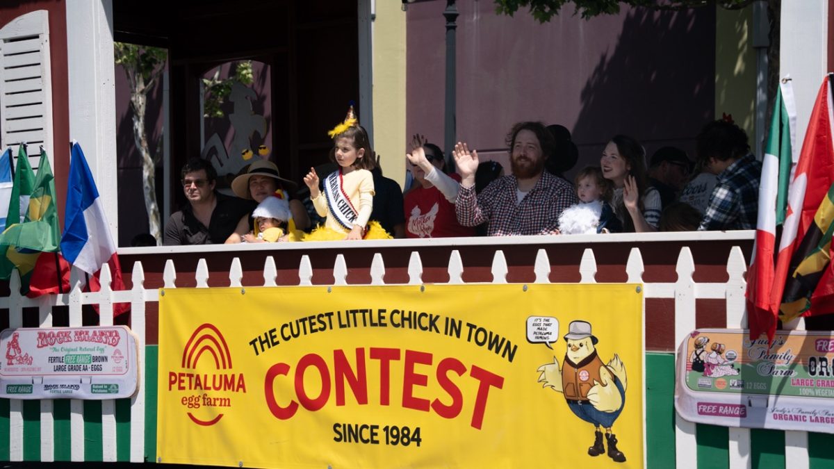 Winners of the Cutest Little Chick in Town contest, hosted by Petaluma Egg Farm, sit on the float and wave at the crowd with their respective families on Saturday April 18, 2026. The contest, which started 42 years ago, is for ages zero to five to dress up in costumes and be judged on their costumes' poultry themes and creativity.