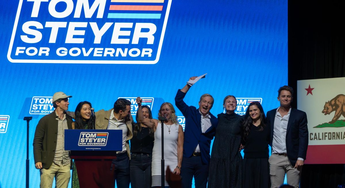 Gubernatorial candidate Tom Steyer is crowded by his family on stage at his primary election night watch party at the Regency Ballroom on Tuesday, June 2, 2026 in San Francisco, Calif. (Nicholas Vides / For The Oak Leaf News)