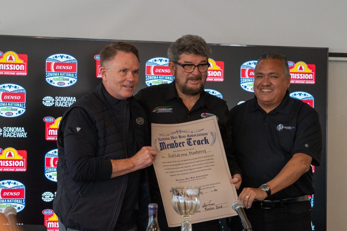 (Left to Right) NHRA President Glen Cromwell, Autódromo de Monterrey CEO Gilberto Jimenez, and Century Prime Global President Rudy Gutierrez hold up the member track declaration for Autódromo de Monterrey at the John Cardinal Media Center at Sonoma Raceway on Saturday, July 18, 2026 in Sonoma.