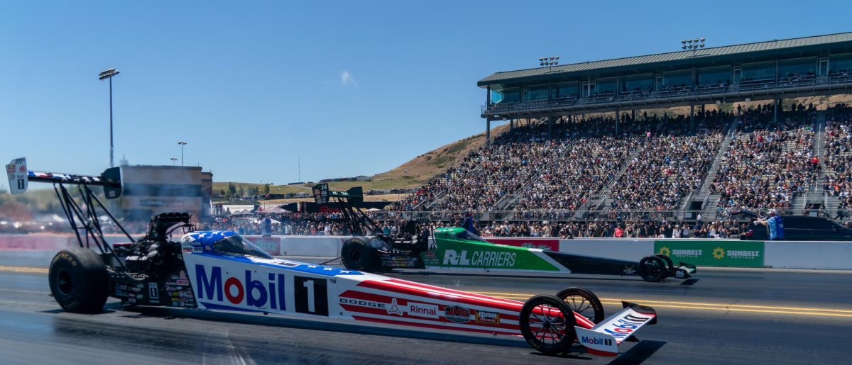 Top Fuel driver Leah Pruett, front, races against her husband, Tony Stewart, during the during the third round of qualifying at the DENSO NHRA Sonoma Nationals on Saturday, July 18, 2026 in Sonoma.