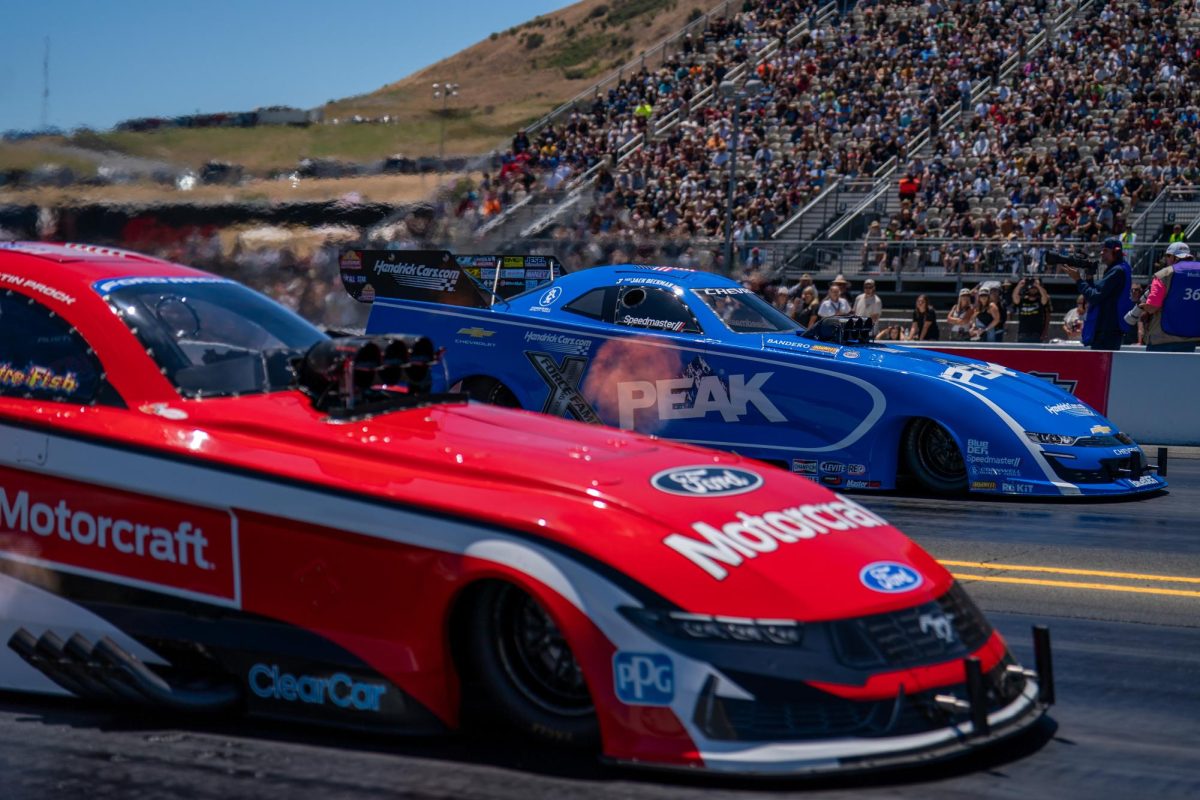 Funny Car driver Austin Prock, front, races against "Fast Jack" Beckman during the third round of qualifying at the DENSO NHRA Sonoma Nationals on Saturday, July 18, 2026 in Sonoma.