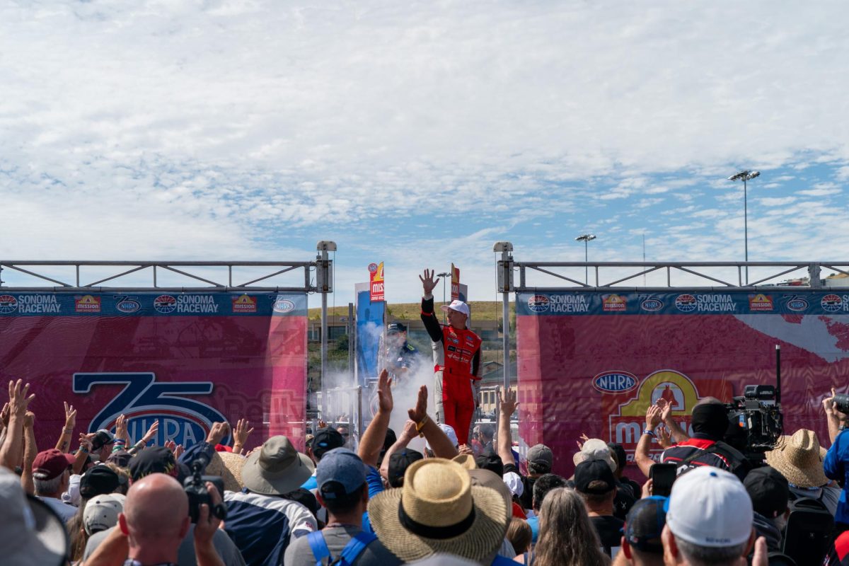 Funny Car driver Austin Prock waves to fans during pre-race ceremonies at the DENSO NHRA Sonoma Nationals on Sunday, July 19, 2026 in Sonoma.