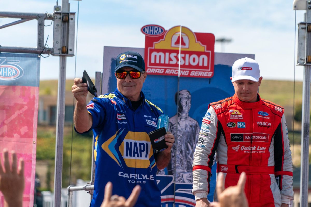 Funny Car drivers Ron Capps and Austin Prock wave to fans during pre-race ceremonies at the DENSO NHRA Sonoma Nationals on Sunday, July 19, 2026 in Sonoma.