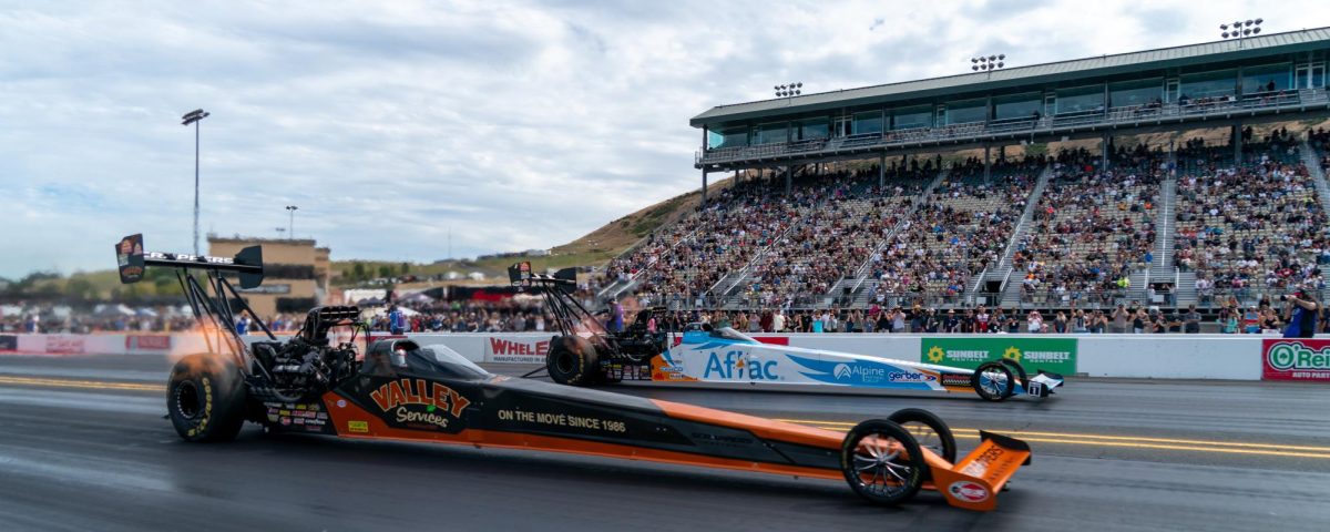 Top Fuel driver Doug Kalitta, back, wins the Wally against Jasmine Salinas at the DENSO NHRA Sonoma Nationals on Sunday, July 19, 2026 in Sonoma.