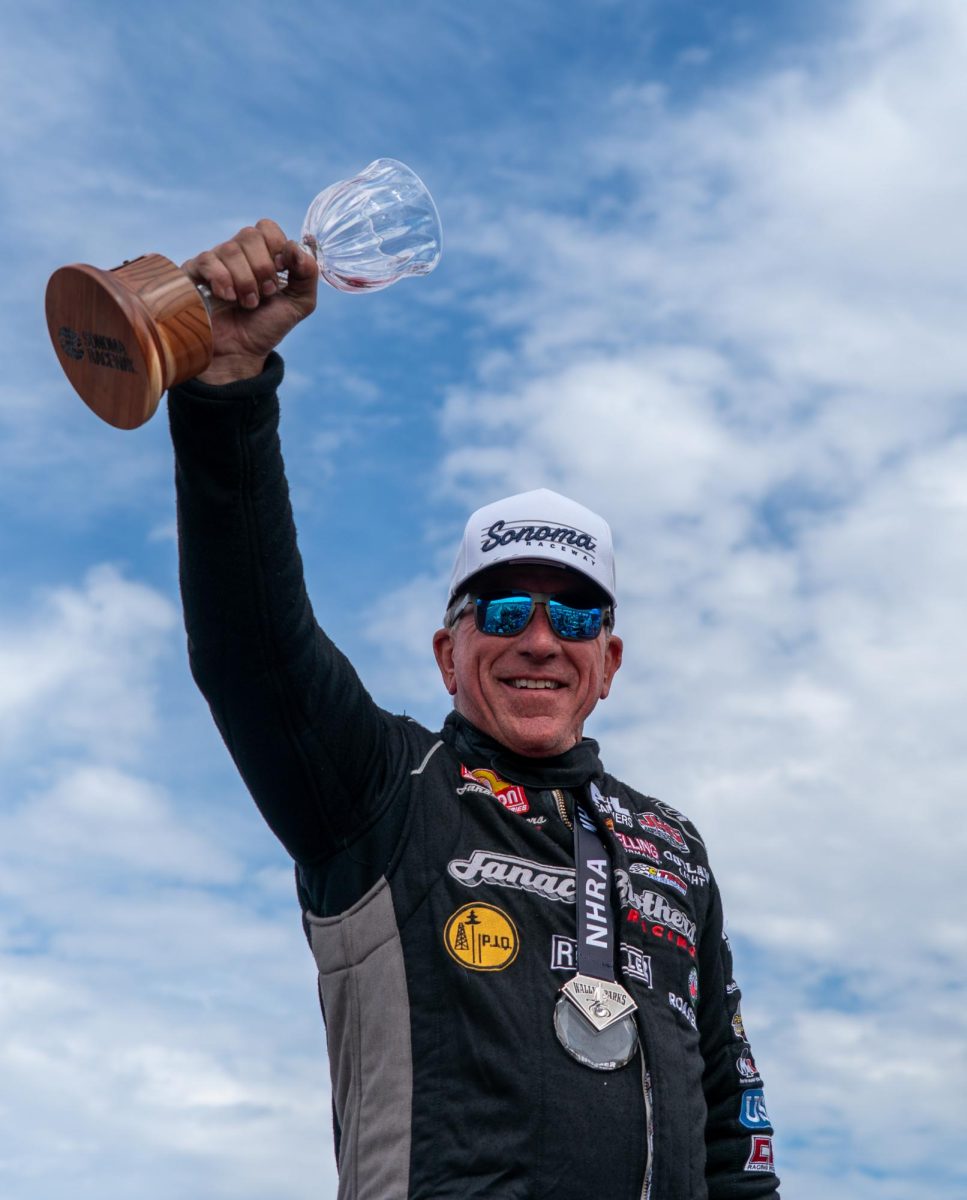 Pro Stock driver Greg Stanfield holds his victory goblet high at the DENSO NHRA Sonoma Nationals on Sunday, July 19, 2026 in Sonoma.